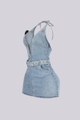 Washed denim halter mini dress with deep plunging V neck featuring center cutout with criss cross lace up detail