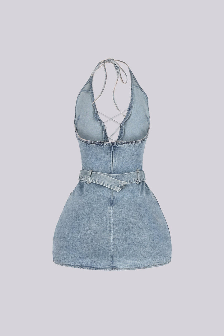 Washed denim halter mini dress with deep plunging V neck featuring center cutout with criss cross lace up detail