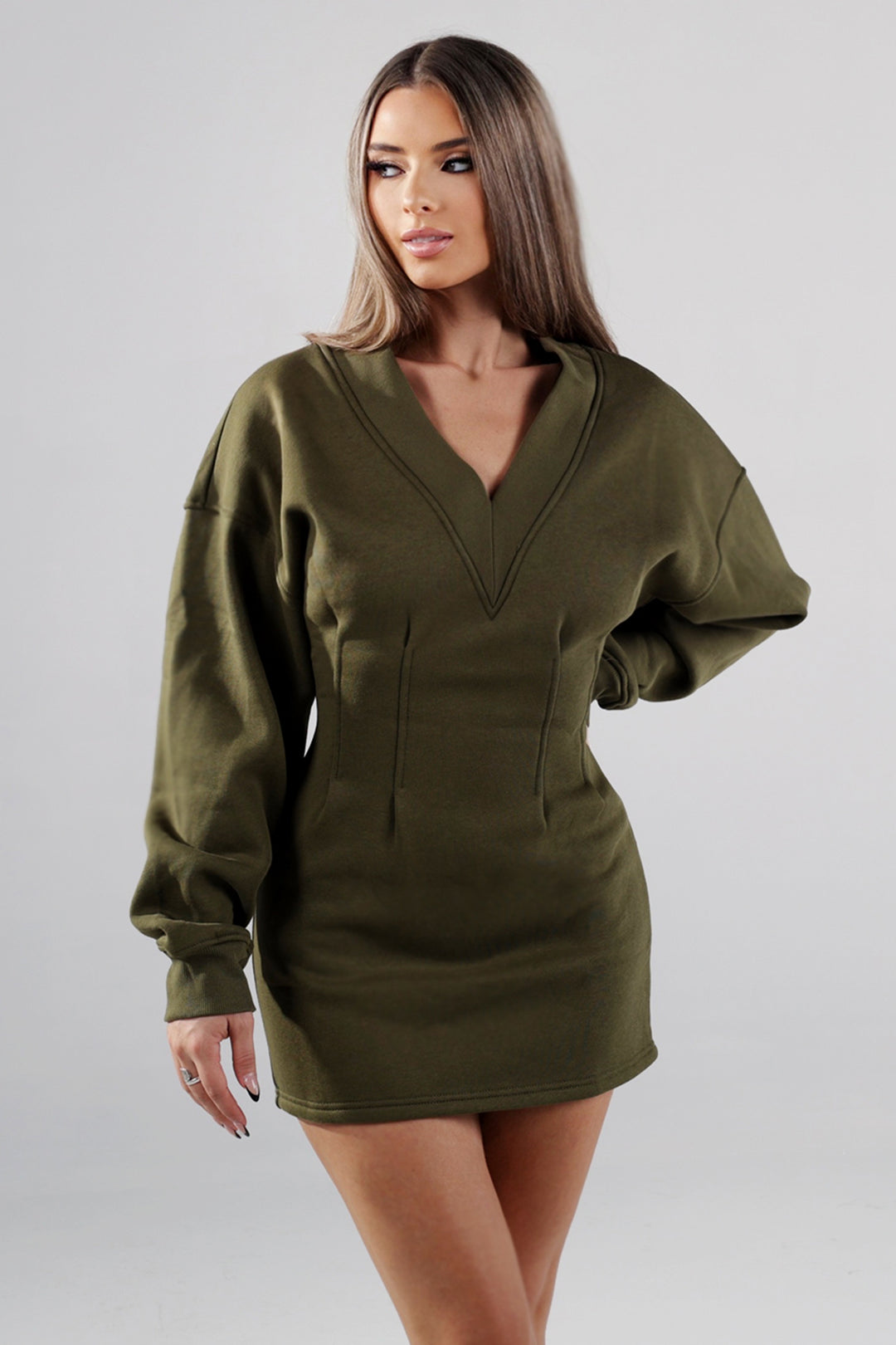 Fitted mini dress with a deep V neckline and dolman long sleeves
