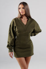 Fitted mini dress with a deep V neckline and dolman long sleeves