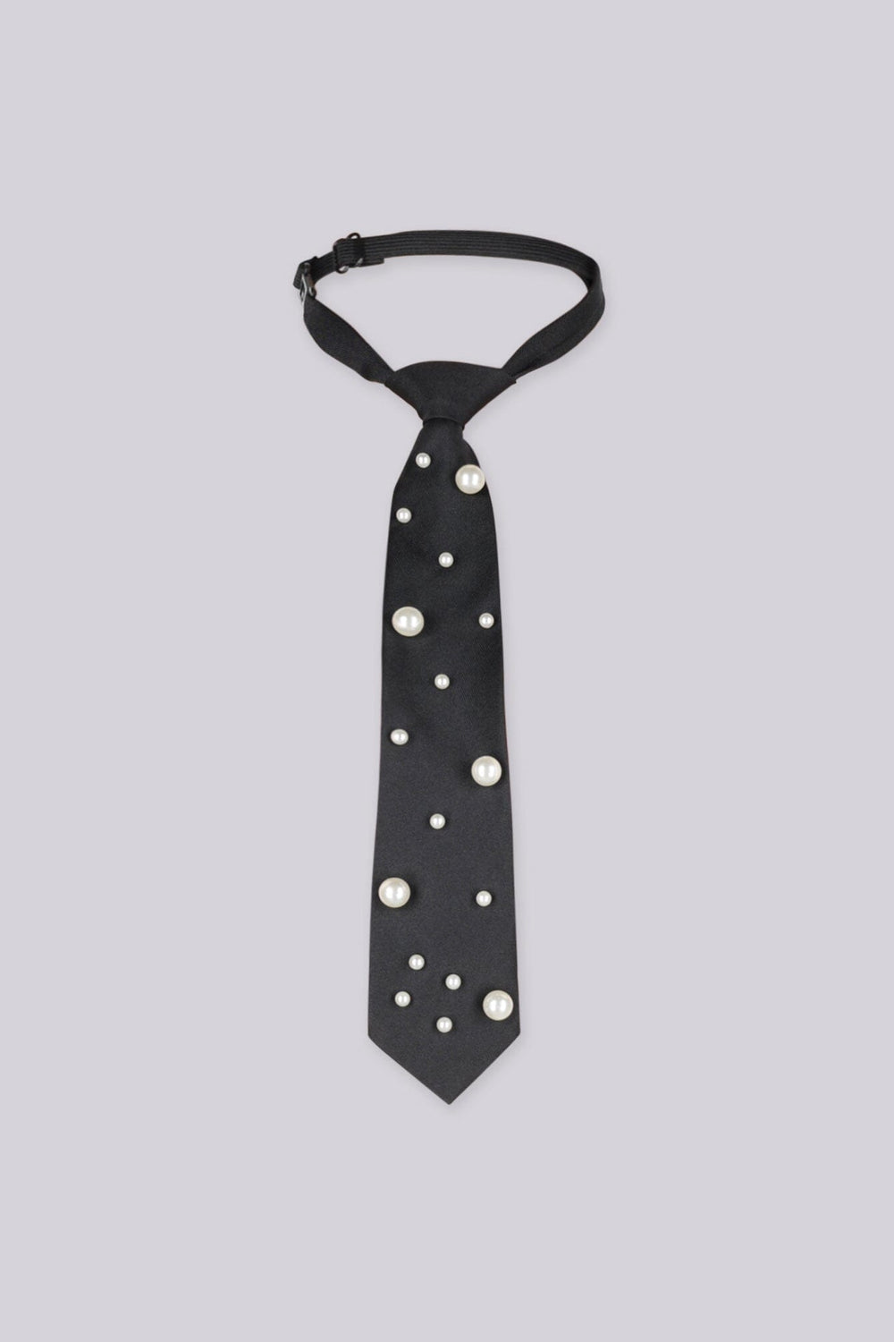 Black necktie embellished with large pearls, front view flat lay