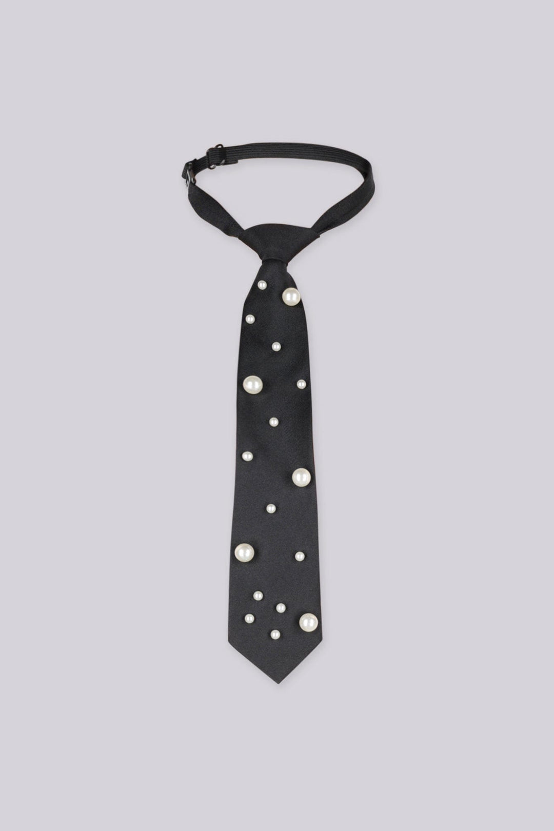 Black necktie embellished with large pearls, front view flat lay