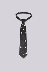 Black necktie embellished with large pearls, front view flat lay