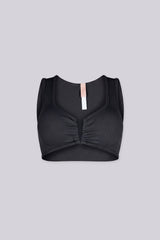 Ribbed knit crop tank top featuring V shape cutout at center front into a small ruched cinch