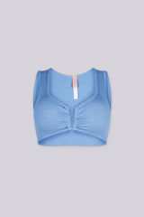 Ribbed knit crop tank top featuring V shape cutout at center front into a small ruched cinch