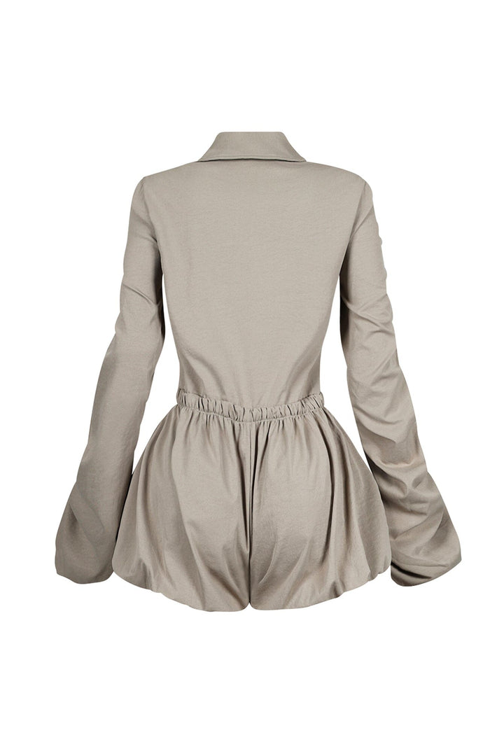 Pointed collared long sleeve romper with drawstring cinch waist with self tie bow featuring bubble hem skirt
Ruching along the outer shoulder seams  