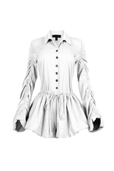 Pointed collared long sleeve romper with drawstring cinch waist with self tie bow featuring bubble hem skirt
Ruching along the outer shoulder seams  