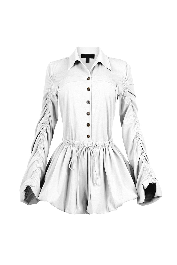 Pointed collared long sleeve romper with drawstring cinch waist with self tie bow featuring bubble hem skirt
Ruching along the outer shoulder seams  