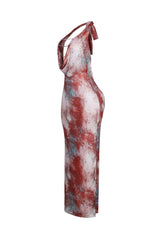 Mesh halter maxi dress with plunging cowl neckline featuring layered metallic chain details across the open plunge
