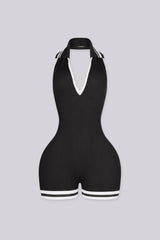 EDGEBYKS - Ribbed knit sleeveless collared romper featuring a plunging halter neckline, black front view