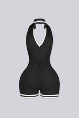 EDGEBYKS - Ribbed knit sleeveless collared romper featuring a plunging halter neckline, black back view