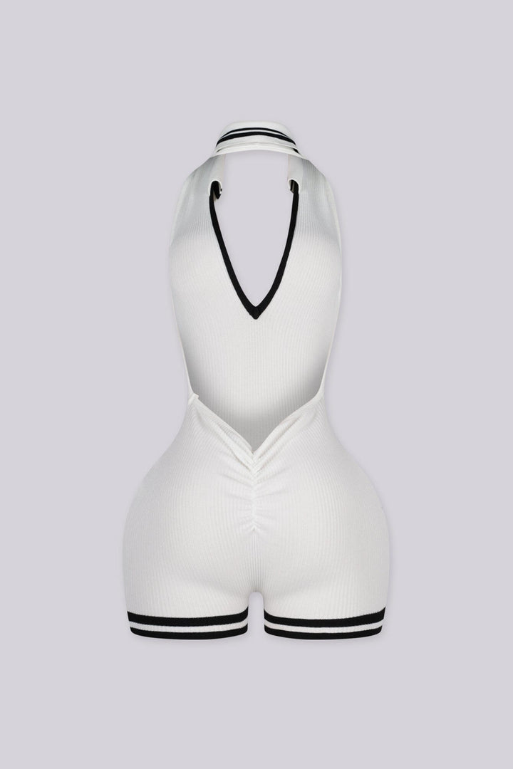 EDGEBYKS - Ribbed knit sleeveless collared romper featuring a plunging halter neckline, white back view