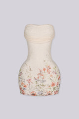 Strapless tube mini dress in sheer floral mesh with all over beaded detailing
Soft straight neckline with an inner silicone grip