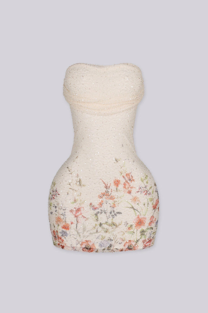 Strapless tube mini dress in sheer floral mesh with all over beaded detailing
Soft straight neckline with an inner silicone grip