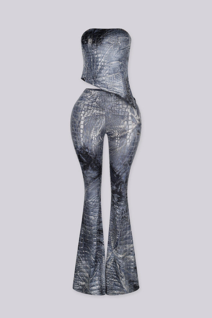 Strapless fitted crop tube top in a glossy crocodile embossed print with asymmetrical draped hem crossing at the front