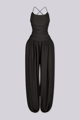 Tank top jumpsuit featuring draped cowl neckline with adjustable straps, Subtle horizontal ruched gathering across, Heavy gathering pants that taper at the bottom with elasticized ankle cuffs