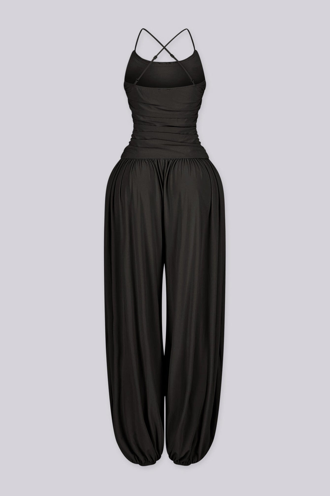 Tank top jumpsuit featuring draped cowl neckline with adjustable straps, Subtle horizontal ruched gathering across, Heavy gathering pants that taper at the bottom with elasticized ankle cuffs