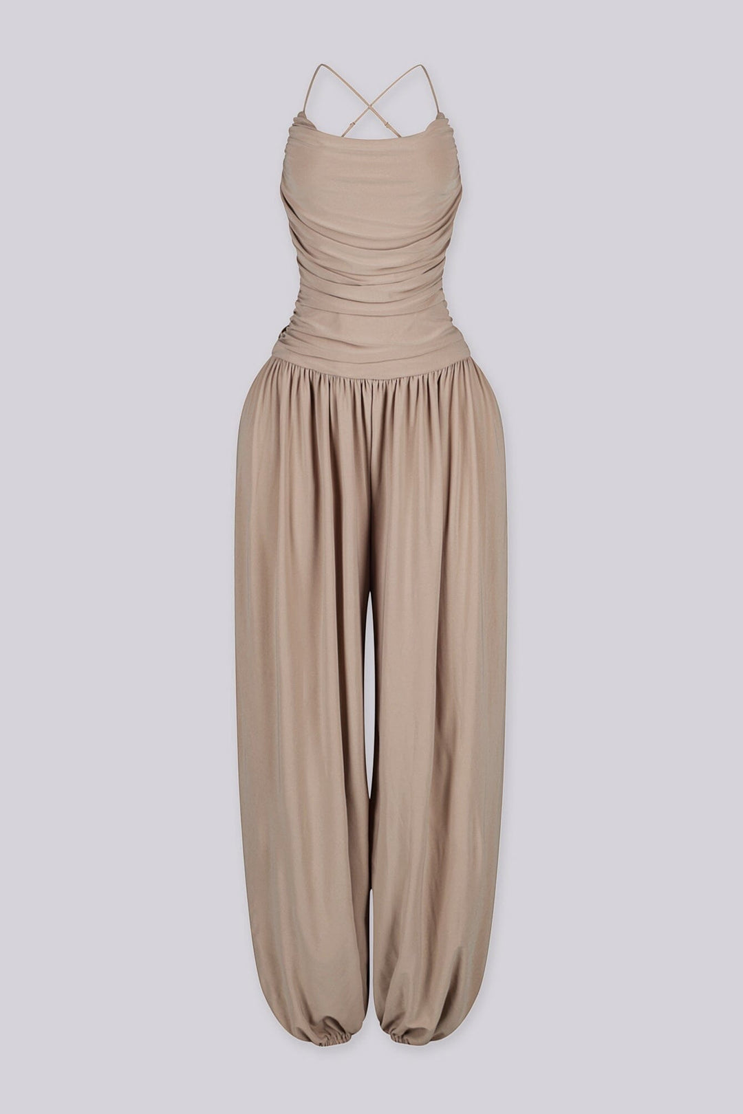 Tank top jumpsuit featuring draped cowl neckline with adjustable straps, Subtle horizontal ruched gathering across, Heavy gathering pants that taper at the bottom with elasticized ankle cuffs
