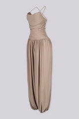 Tank top jumpsuit featuring draped cowl neckline with adjustable straps, Subtle horizontal ruched gathering across, Heavy gathering pants that taper at the bottom with elasticized ankle cuffs