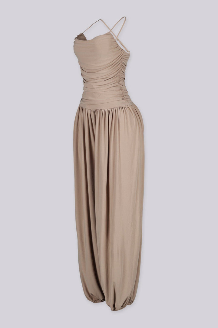 Tank top jumpsuit featuring draped cowl neckline with adjustable straps, Subtle horizontal ruched gathering across, Heavy gathering pants that taper at the bottom with elasticized ankle cuffs
