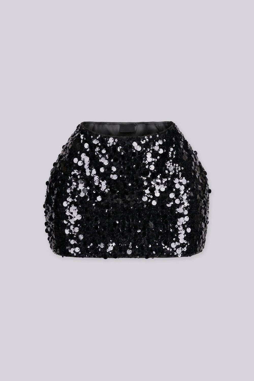 Low rise mini skirt fully covered in oversized metallic sequins and shimmering disc paillettes