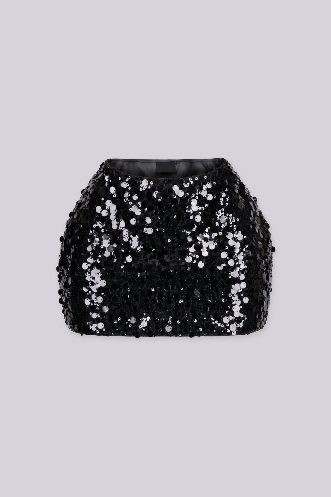 Low rise mini skirt fully covered in oversized metallic sequins and shimmering disc paillettes