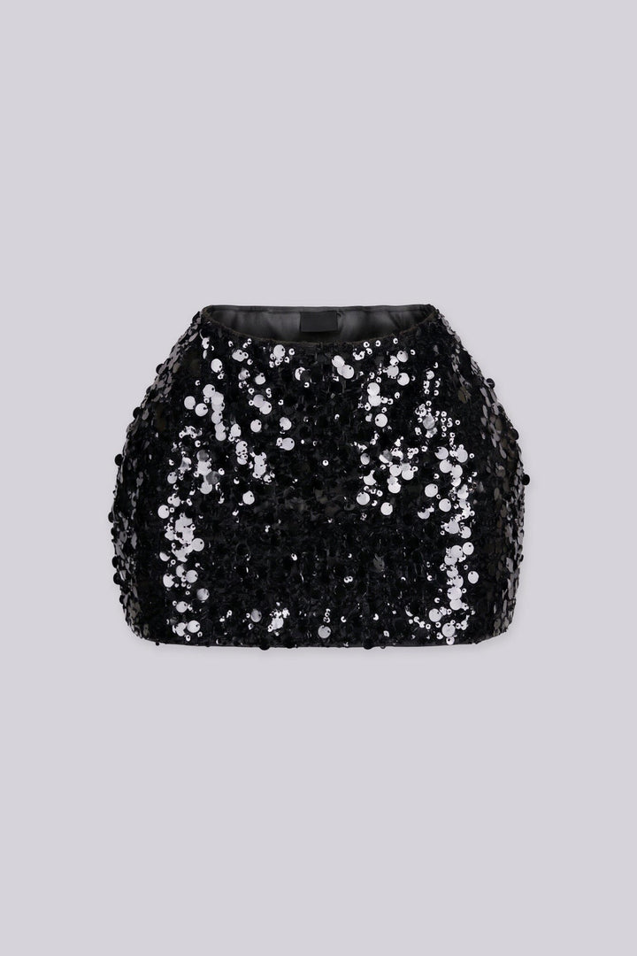 Low rise mini skirt fully covered in oversized metallic sequins and shimmering disc paillettes
