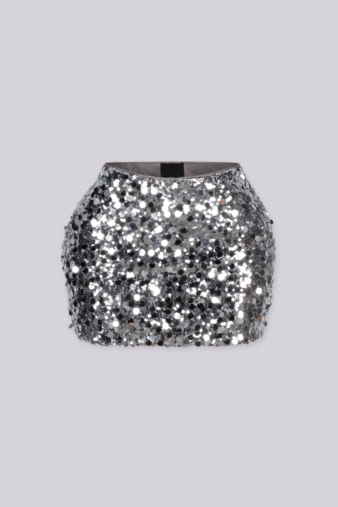 Low rise mini skirt fully covered in oversized metallic sequins and shimmering disc paillettes