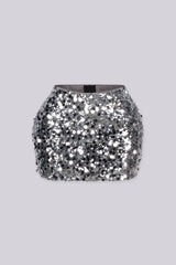 Low rise mini skirt fully covered in oversized metallic sequins and shimmering disc paillettes