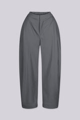 High waisted balloon shape cropped pants featuring tapered ankle cuffs with a snap button closured hem