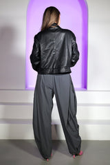 High waisted balloon shape cropped pants featuring tapered ankle cuffs with a snap button closured hem