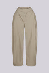 High waisted balloon shape cropped pants featuring tapered ankle cuffs with a snap button closured hem