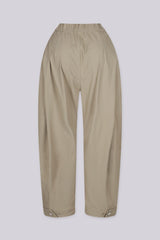High waisted balloon shape cropped pants featuring tapered ankle cuffs with a snap button closured hem