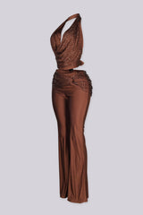 Cropped halter top with deep plunging cowl draped neckline featuring rhinestone embellishments throughout