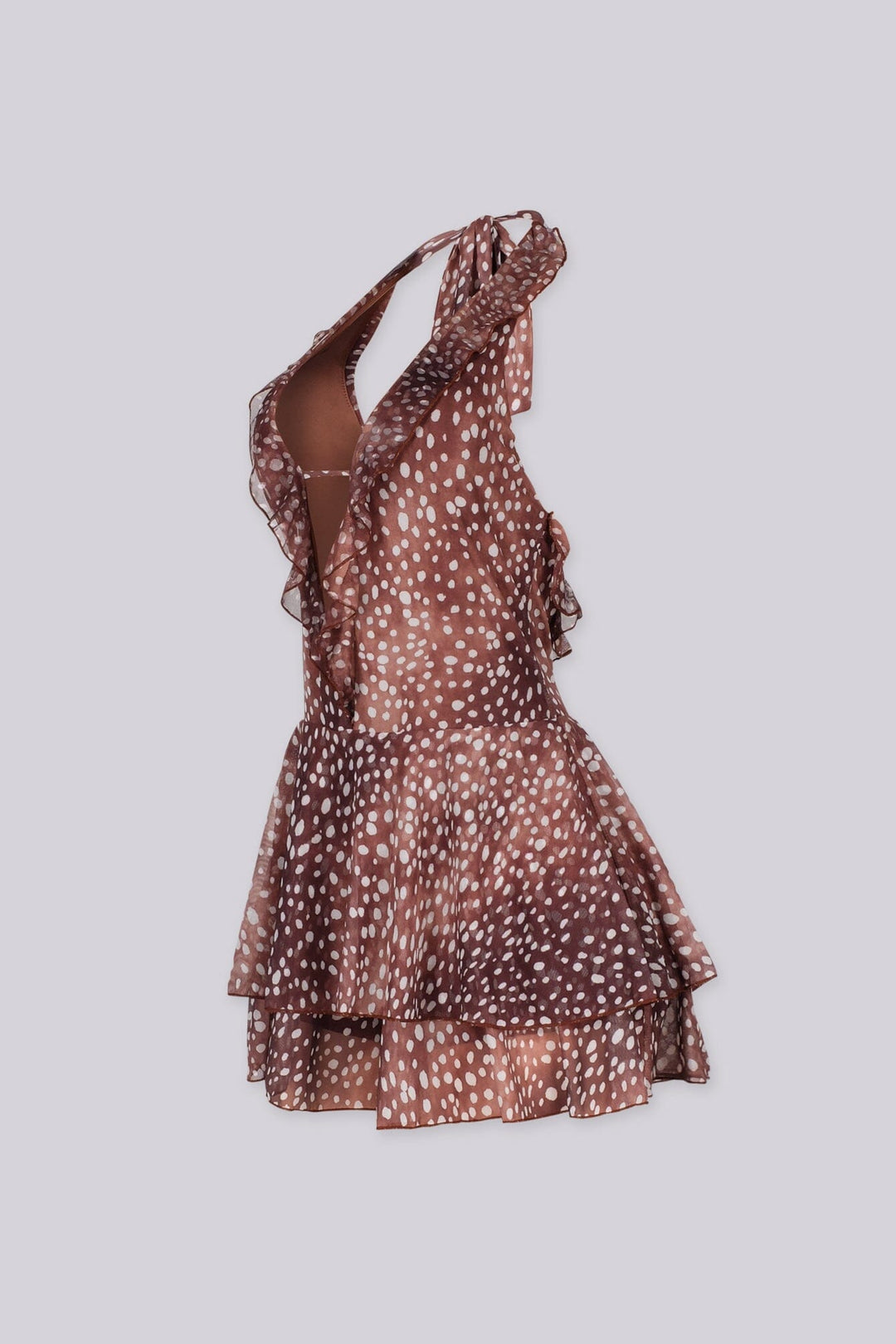 Polka dot deep plunging halter neckline romper featuring cascading ruffle trim along the center front
Adjustable halter tie strap at nape
