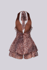 Polka dot deep plunging halter neckline romper featuring cascading ruffle trim along the center front
Adjustable halter tie strap at nape