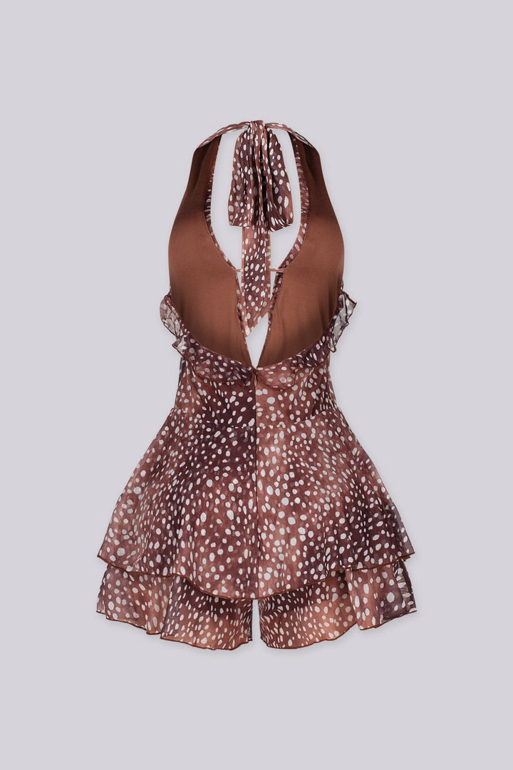 Polka dot deep plunging halter neckline romper featuring cascading ruffle trim along the center front
Adjustable halter tie strap at nape