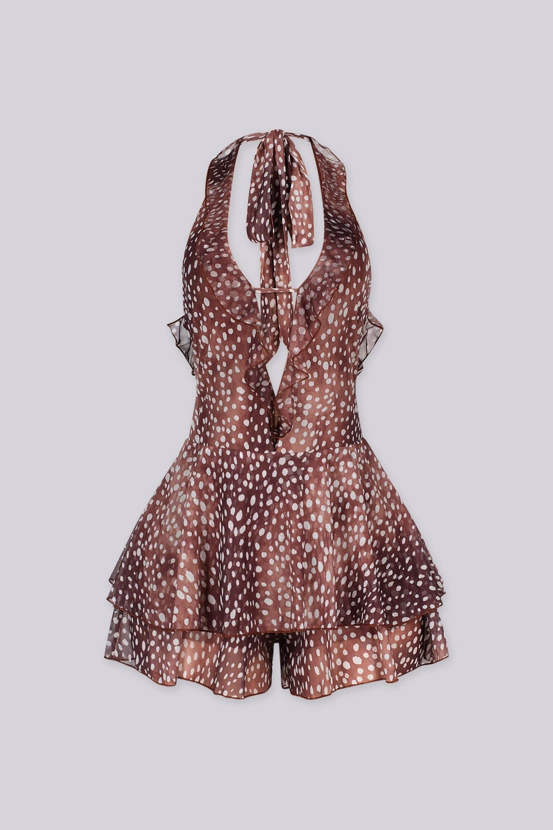 Polka dot deep plunging halter neckline romper featuring cascading ruffle trim along the center front
Adjustable halter tie strap at nape