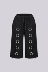Relaxed fit longline Bermuda style sweat shorts
Functional side pockets and standout oversized silver metal grommets