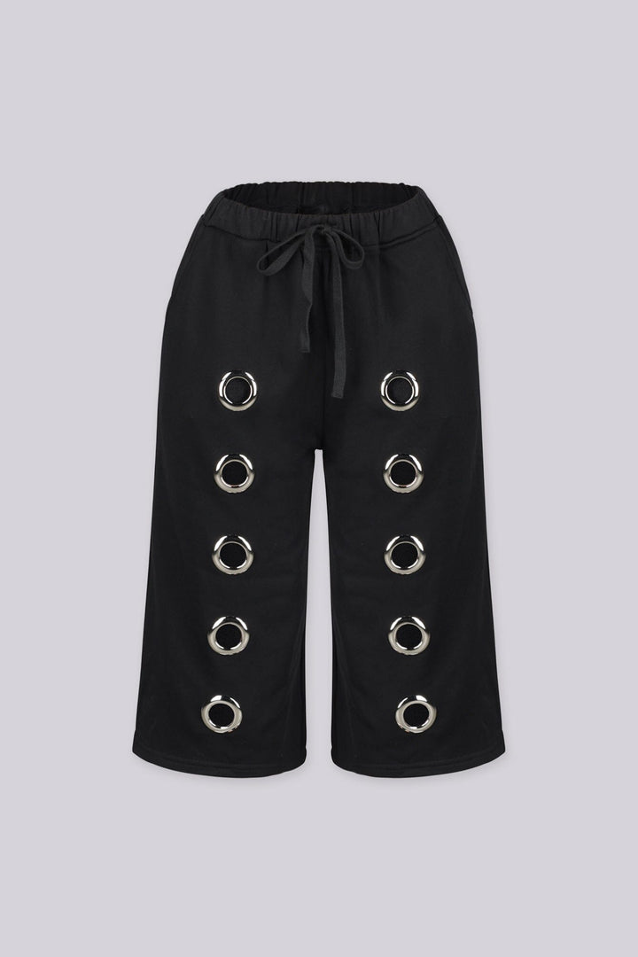 Relaxed fit longline Bermuda style sweat shorts
Functional side pockets and standout oversized silver metal grommets