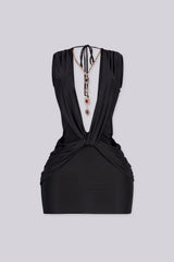 Plunging V neckline with a sculpted twist knot detail at the waist