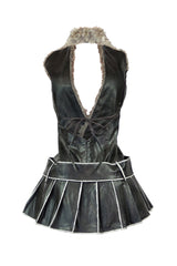 Deep plunging V neck mini dress with faux fur collar in halter neckline
Pleated mini skirt with high contrast piping details featuring wide belt with oversized metal grommets