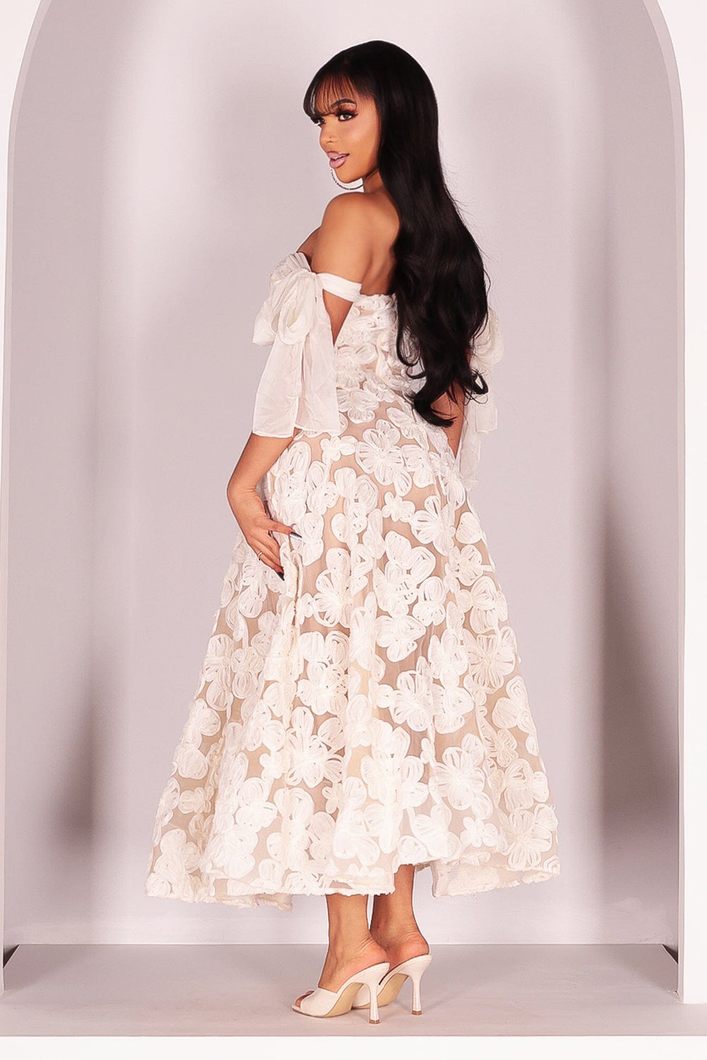 Nude tone lining with layered mesh support creates a soft A line silhouette
Semi sheer floral pattern overlay adds depth and a delicate layered finish