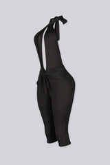 Deep plunge halter capri jumpsuit with draped front with adjustable tie neck closure