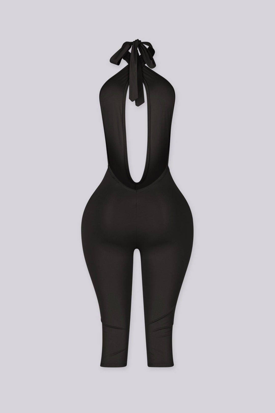 Deep plunge halter capri jumpsuit with draped front with adjustable tie neck closure