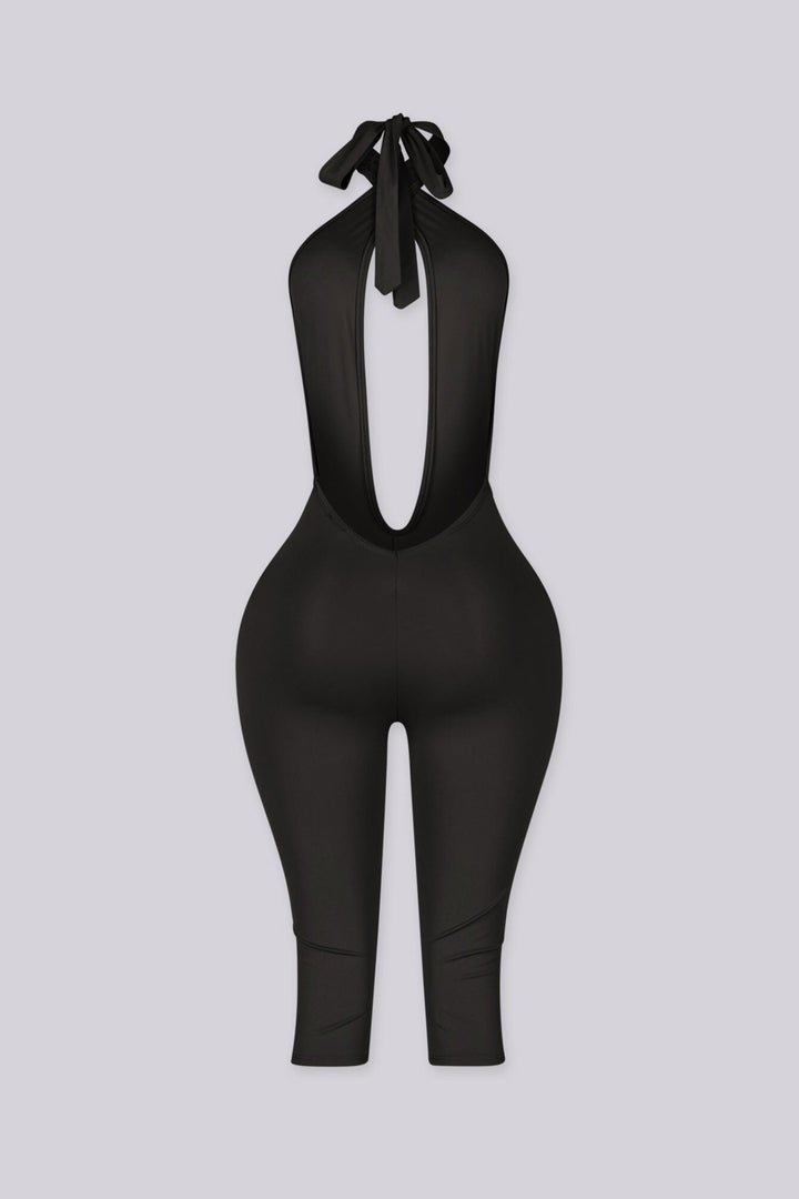 Deep plunge halter capri jumpsuit with draped front with adjustable tie neck closure