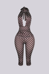 Sleeveless retro polka dot print jumpsuit with high mock collar featuring keyhole cutout opens below the collar