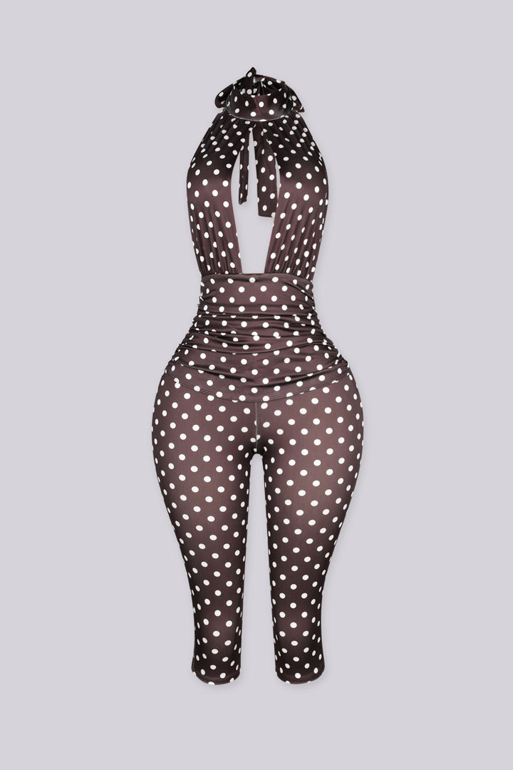 Sleeveless retro polka dot print jumpsuit with high mock collar featuring keyhole cutout opens below the collar