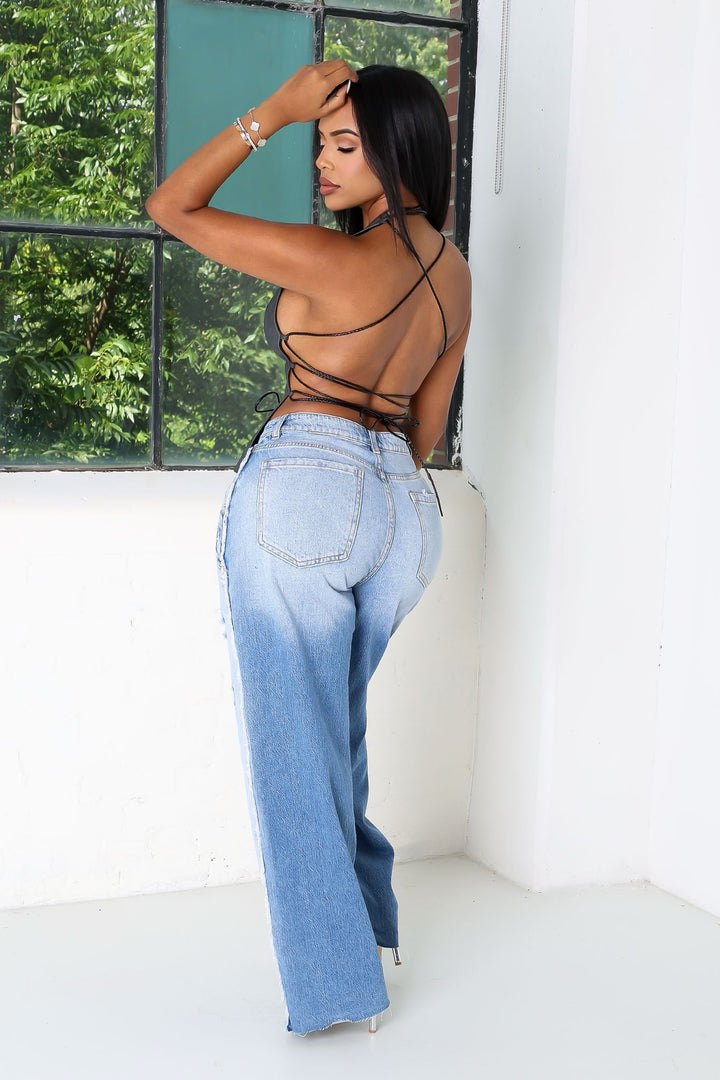 Bold vertical seams wide leg jeans with double pair layered waistband featuring multiple button fly closures and extra belt loops