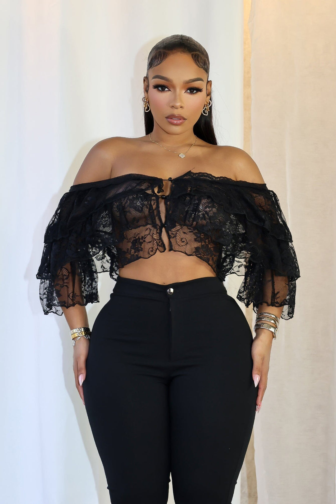 Mesh floral lace crop top with off shoulder neckline featuring layered ruffle details